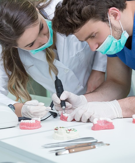 Dental technicians making dentures