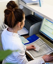 Receptionist at a front desk