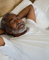 Man resting after dental implant surgery