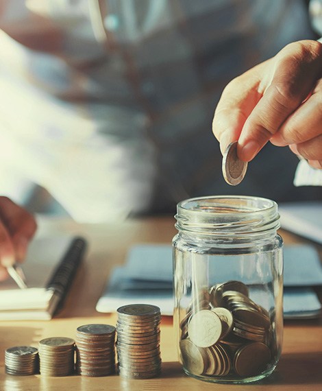 Money being put into a jar