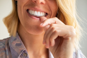 Close up of woman inserting ClearCorrect tray