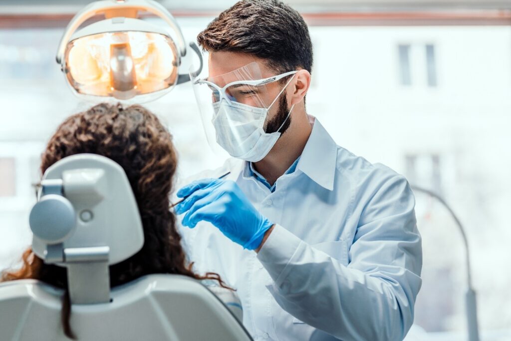 person going through last step of the veneer process